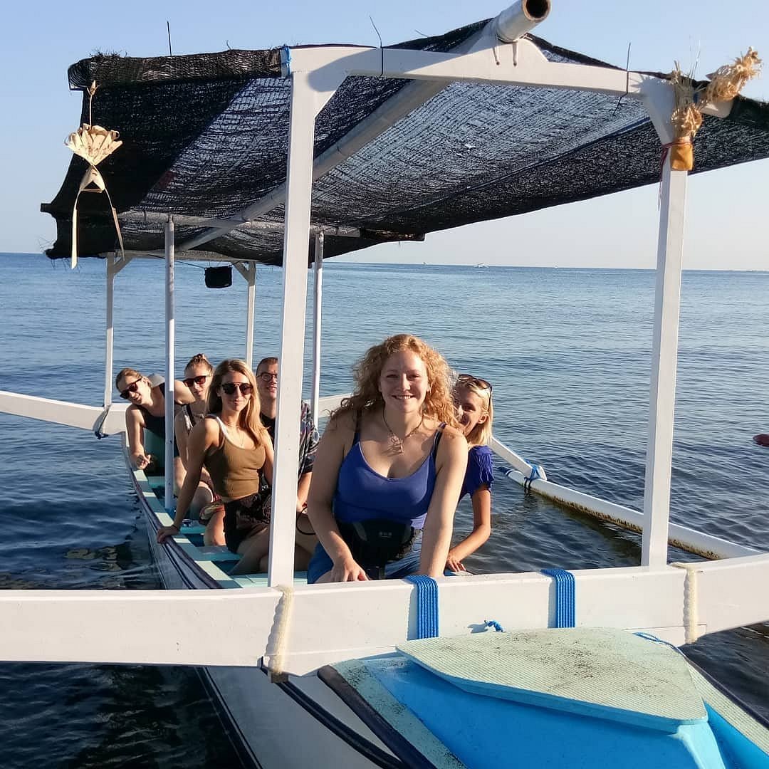 Traditional Balinese fishing boats Jukung carrying tourists dolphin watching Lovina coast